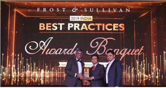 Abhishek Sinha, COO and Board Member, L&T Technology Services receives the Award from Mr. Anand S, Vice President, Frost and Sullivan